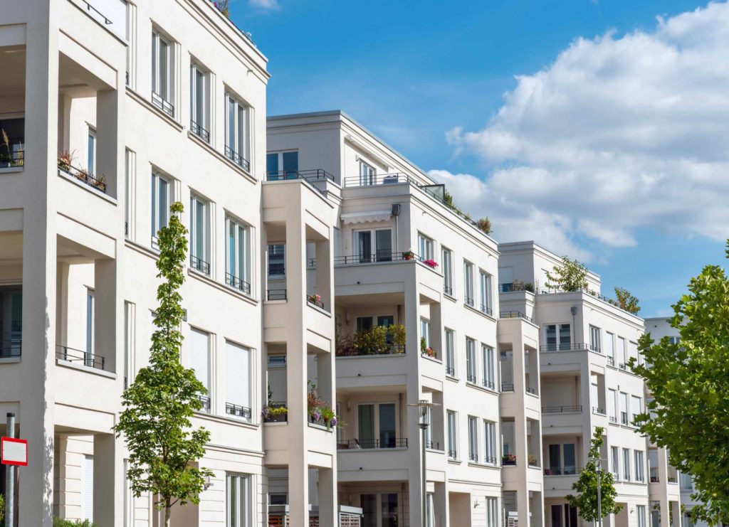 row-of-white-modern-apartment-houses-seen-in-berli-8GW4QEA-1.jpg